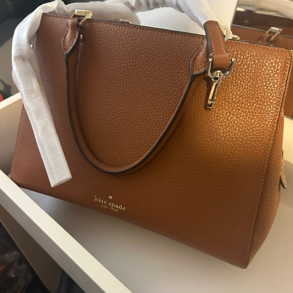 11”x9” Kate Spade satchel very clean & classy, barely used.